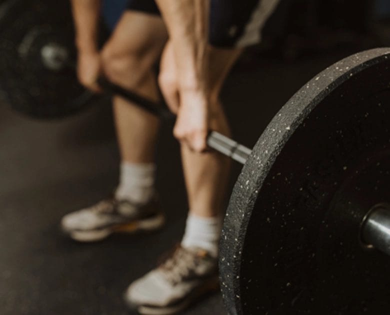 Man lift weight at First Coast Crossfit
